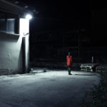 A personal photography project of Elisa Imperi of night photos with a girl with a red jacket