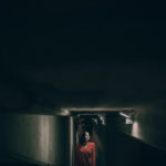 A personal photography project of Elisa Imperi of night photos with a girl with a red jacket